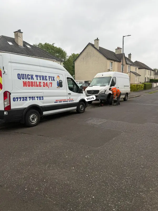 quicktyrefix team working on roadside with its fully equipped van